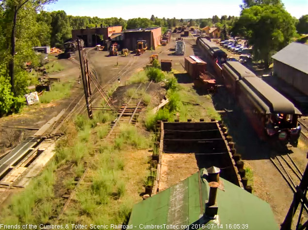 7.14.16 A crew member hangs off the Colorado as a passenger take a picture of the coaling tower.jpg