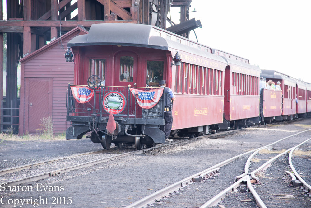 Conductor Chris is ready as the train is almost to the depot.jpg